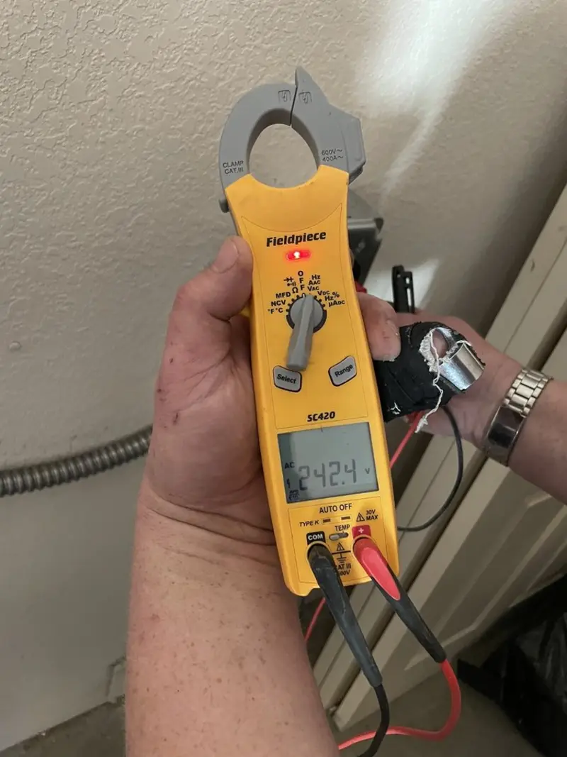 Voltage testing with clamp meter during Generator Installation in New Smyrna Beach